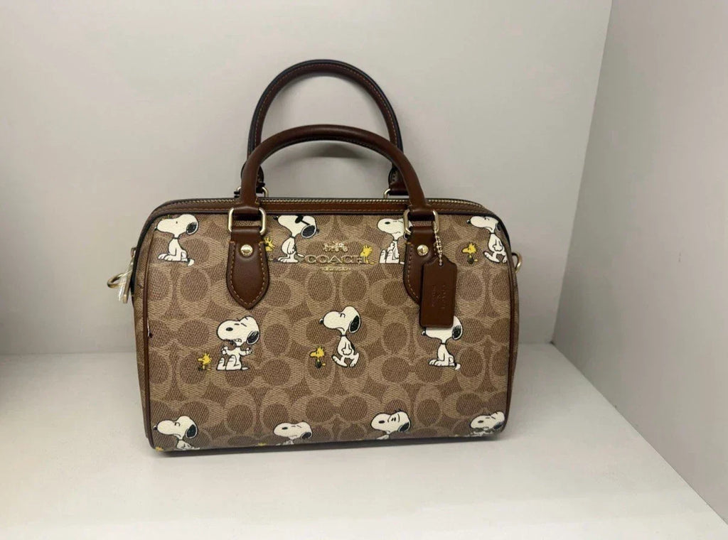 Coach x Peanuts Rowan Satchel Bag Signature Canvas product image 1, provided for visual reference and product detail review