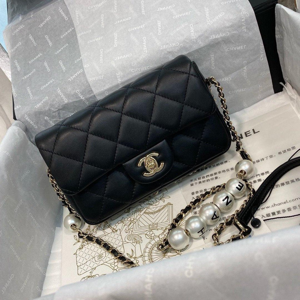 Chanel Pearl Logo Strap Flap Bag Black product image 1, provided for visual reference and product detail review