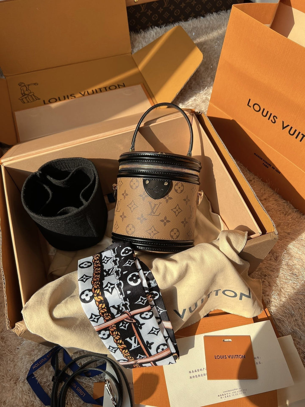LV Cannes Monogram Reverse Canvas Round Top Handle Bag with Leather Trim and Shoulder Strap product image 1, provided for