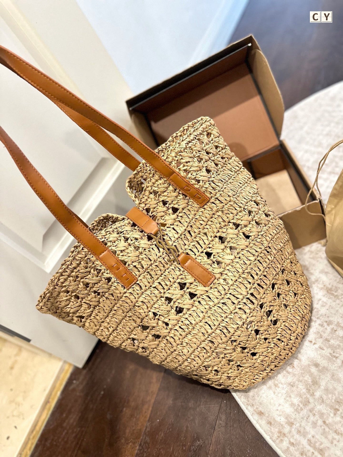 YSL Panier Medium in Raffia and Vegetable-Tanned Leather Tote Bag - Yellow product image 1, provided for visual reference