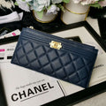 Chanel Caviar Quilted Classic Zip Boy Pouch - Navy product image 1, provided for visual reference and product detail review