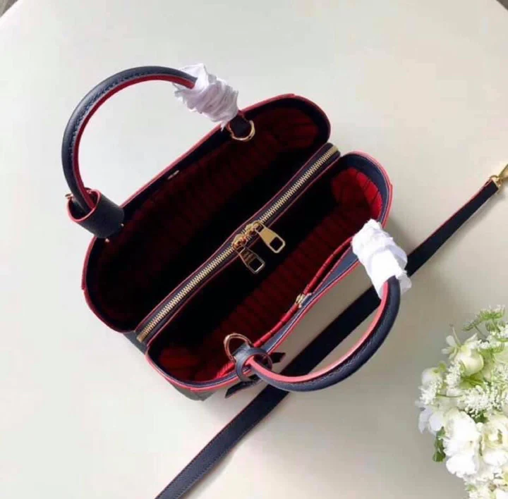 LV Montaigne MM Monogram Empreinte Leather Handle Shoulder Bag with Navy Blue Leather Trim and Shoulder Strap product image