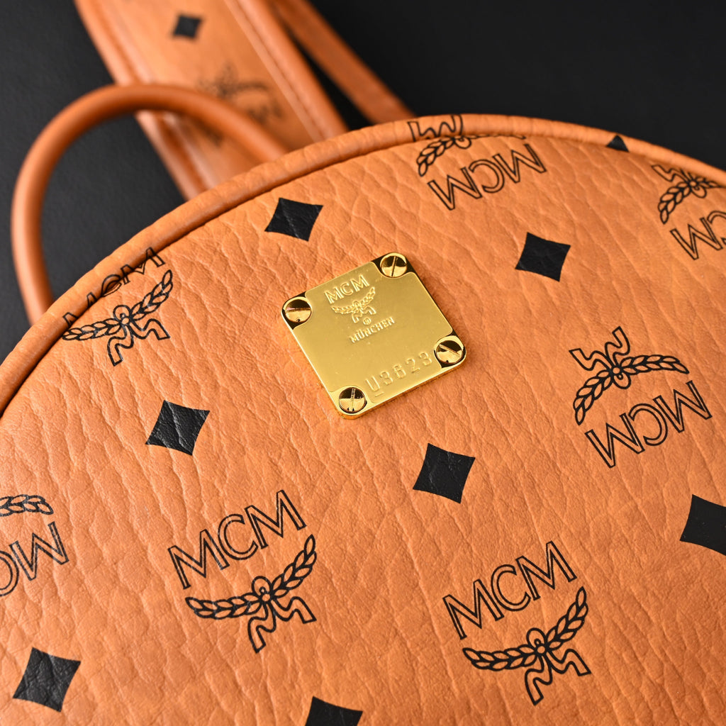 Mcm Stark Visetos Medium Backpack – Cognac Monogram with Gold-Tone Studs - Cognac with Black Monogram Print product image