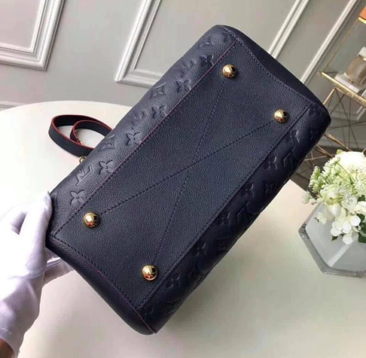 LV Montaigne MM Monogram Empreinte Leather Handle Shoulder Bag with Navy Blue Leather Trim and Shoulder Strap product image