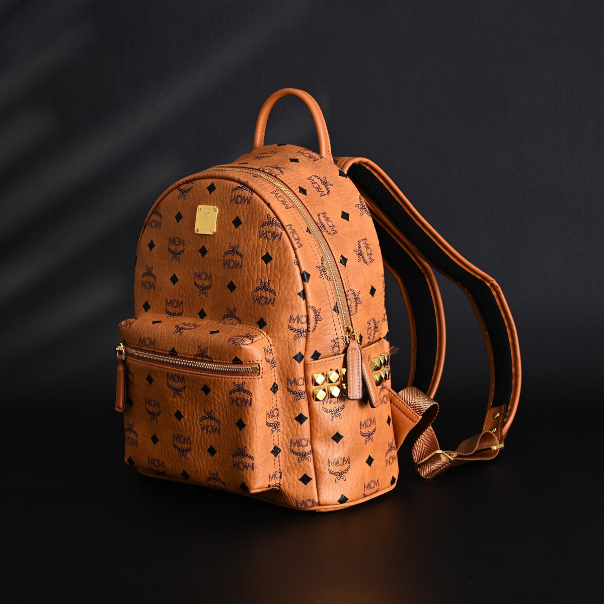 Mcm Stark Visetos Medium Backpack – Cognac Monogram with Gold-Tone Studs - Cognac with Black Monogram Print product image 3,