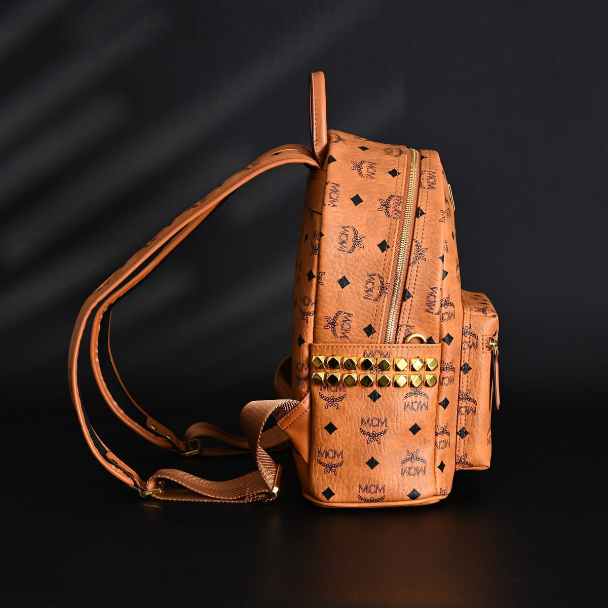 Mcm Stark Visetos Medium Backpack – Cognac Monogram with Gold-Tone Studs - Cognac with Black Monogram Print product image 5,