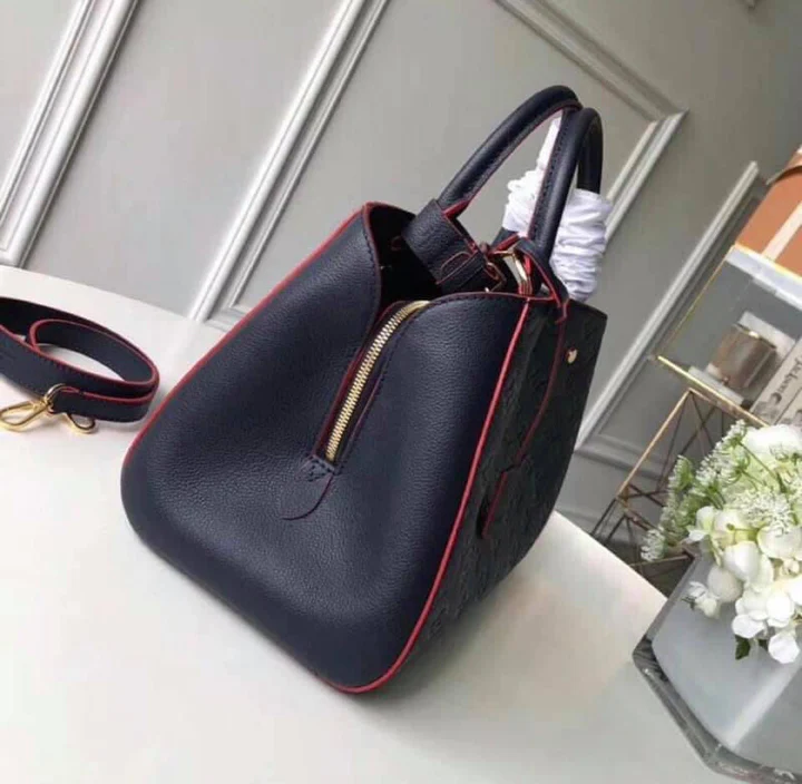 LV Montaigne MM Monogram Empreinte Leather Handle Shoulder Bag with Navy Blue Leather Trim and Shoulder Strap product image