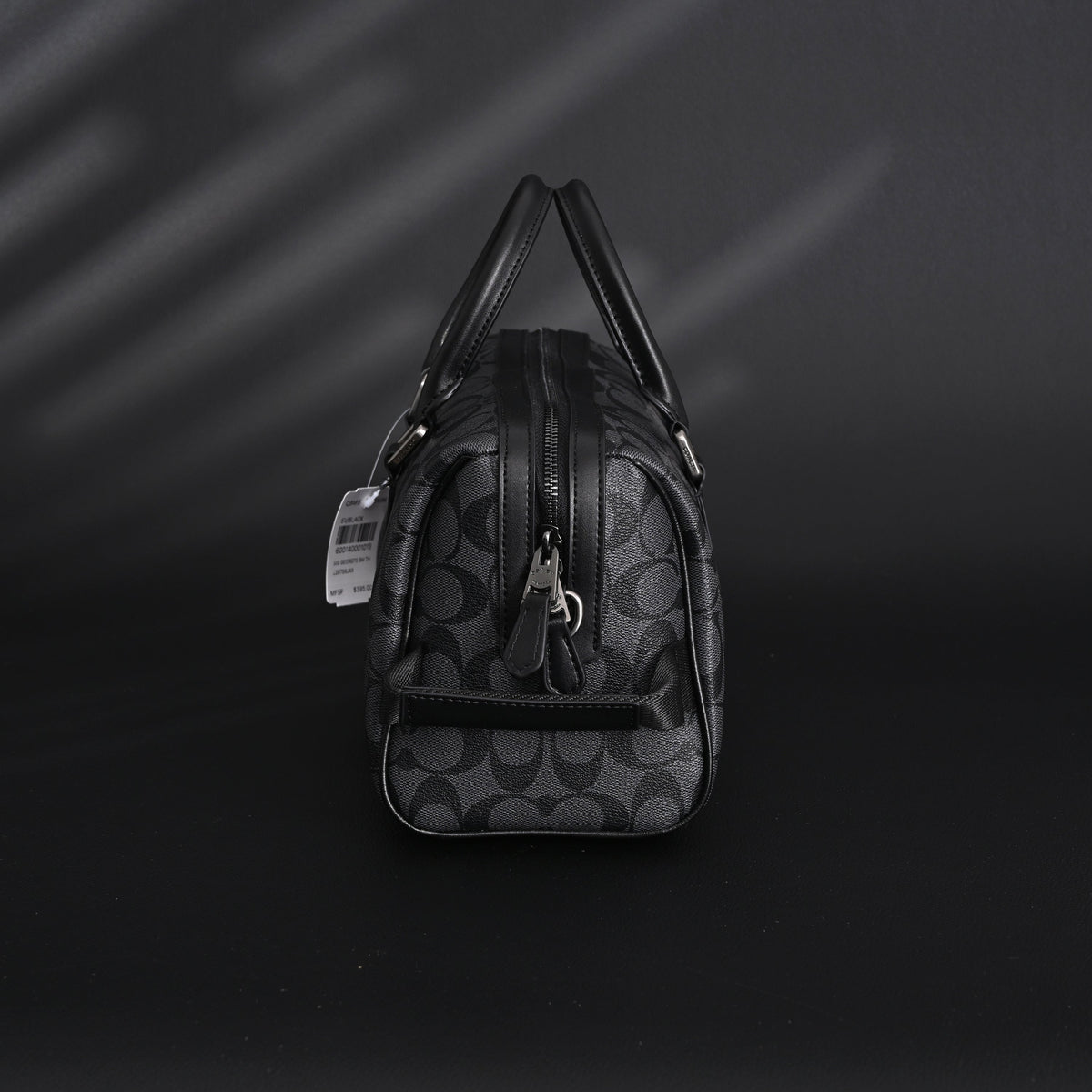 Coach Signature Duffel Bag – Black Monogram Canvas with Leather Trim product image 6, provided for visual reference and