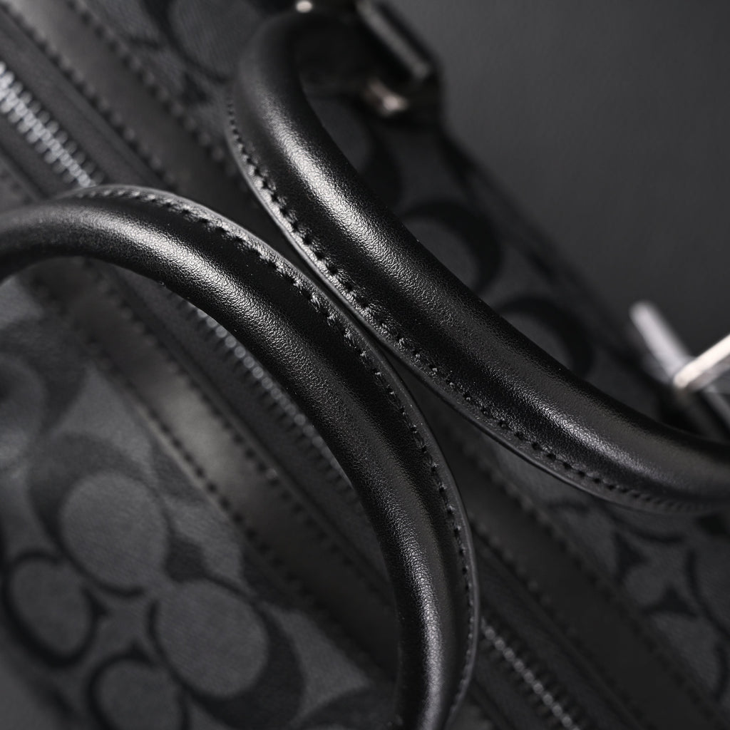 Coach Signature Duffel Bag – Black Monogram Canvas with Leather Trim product image 14, provided for visual reference and