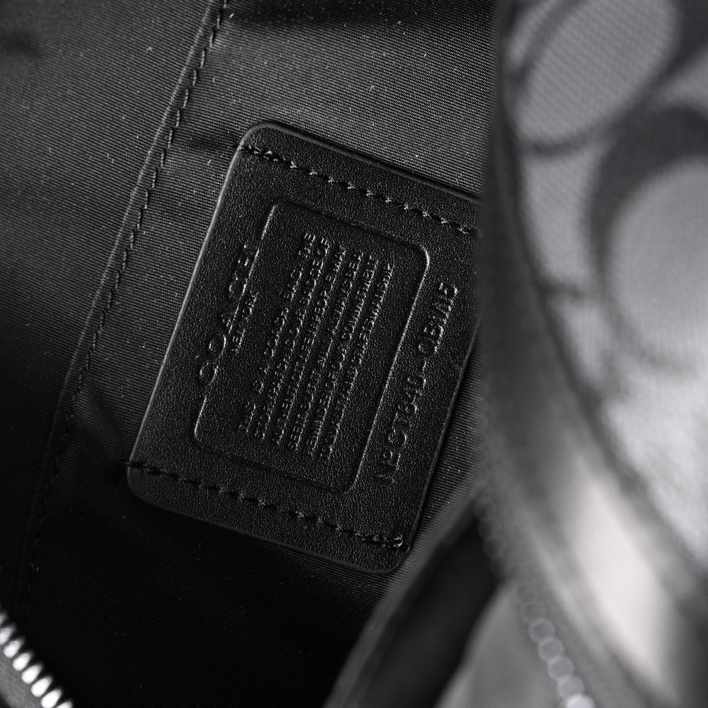 Coach Signature Duffel Bag – Black Monogram Canvas with Leather Trim product image 2, provided for visual reference and