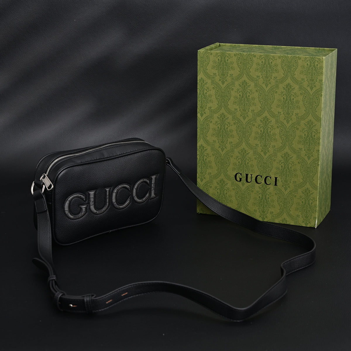 Gucci Black Leather Embossed Logo Belt Bag product image 1, provided for visual reference and product detail review