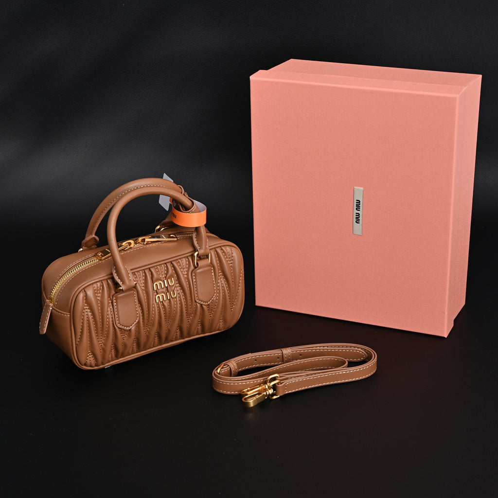 Miu Miu Matelassé Leather Top Handle Bag – Caramel Brown product image 1, provided for visual reference and product detail