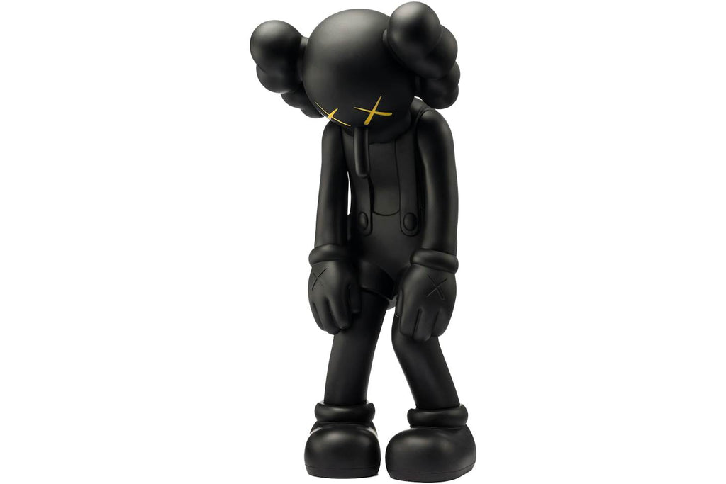 KAWS Small Lie Companion Vinyl Figure - Black product image 1, provided for visual reference and product detail review