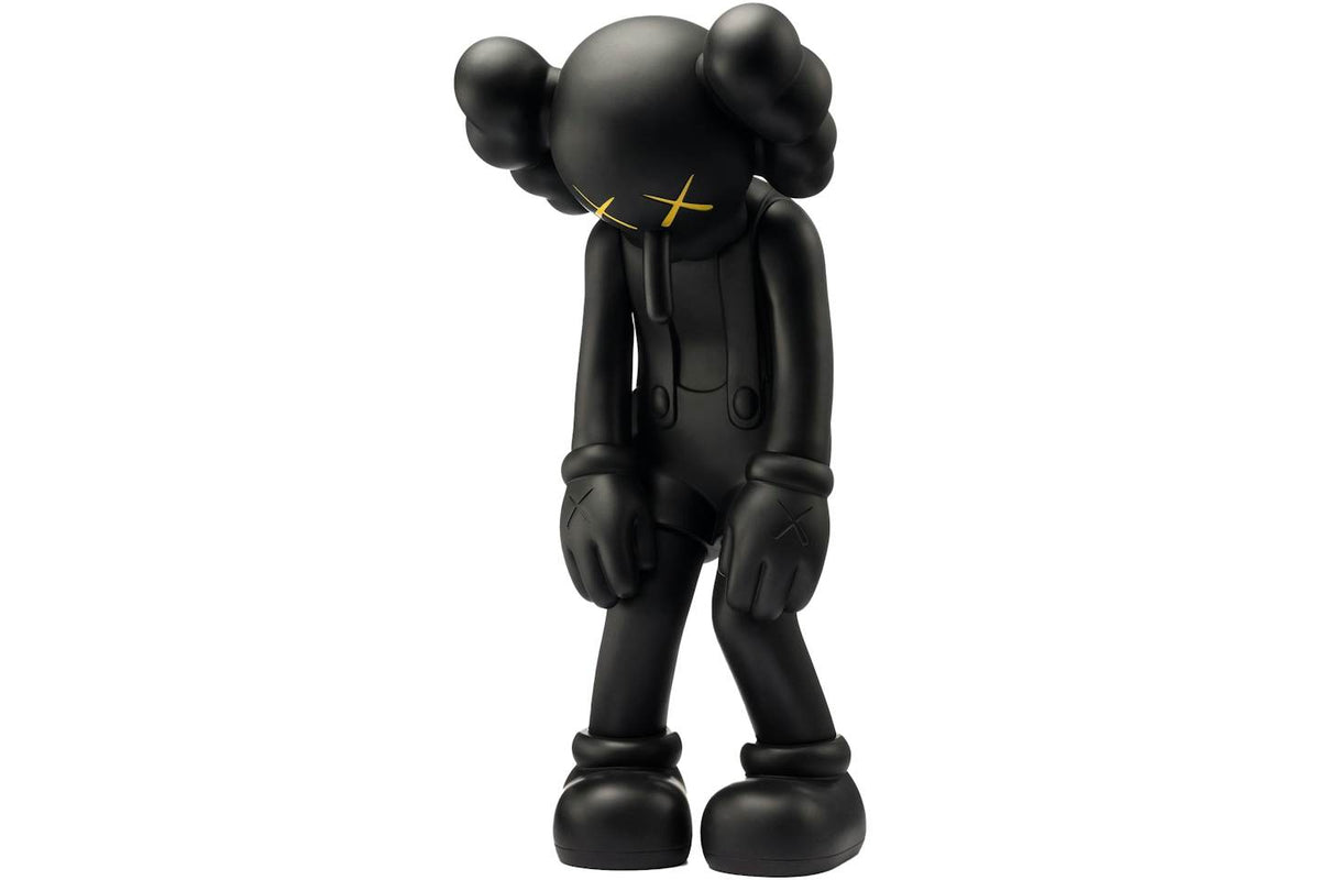 KAWS Small Lie Companion Vinyl Figure - Black product image 1, provided for visual reference and product detail review