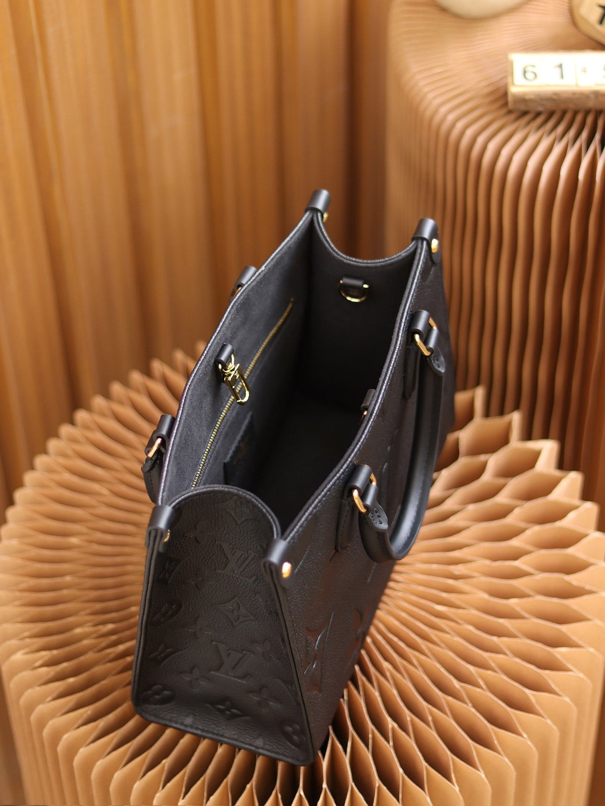 LV OnTheGo PM Monogram Empreinte Leather Tote Handle Bag with Black Leather Trim product image 7, provided for visual