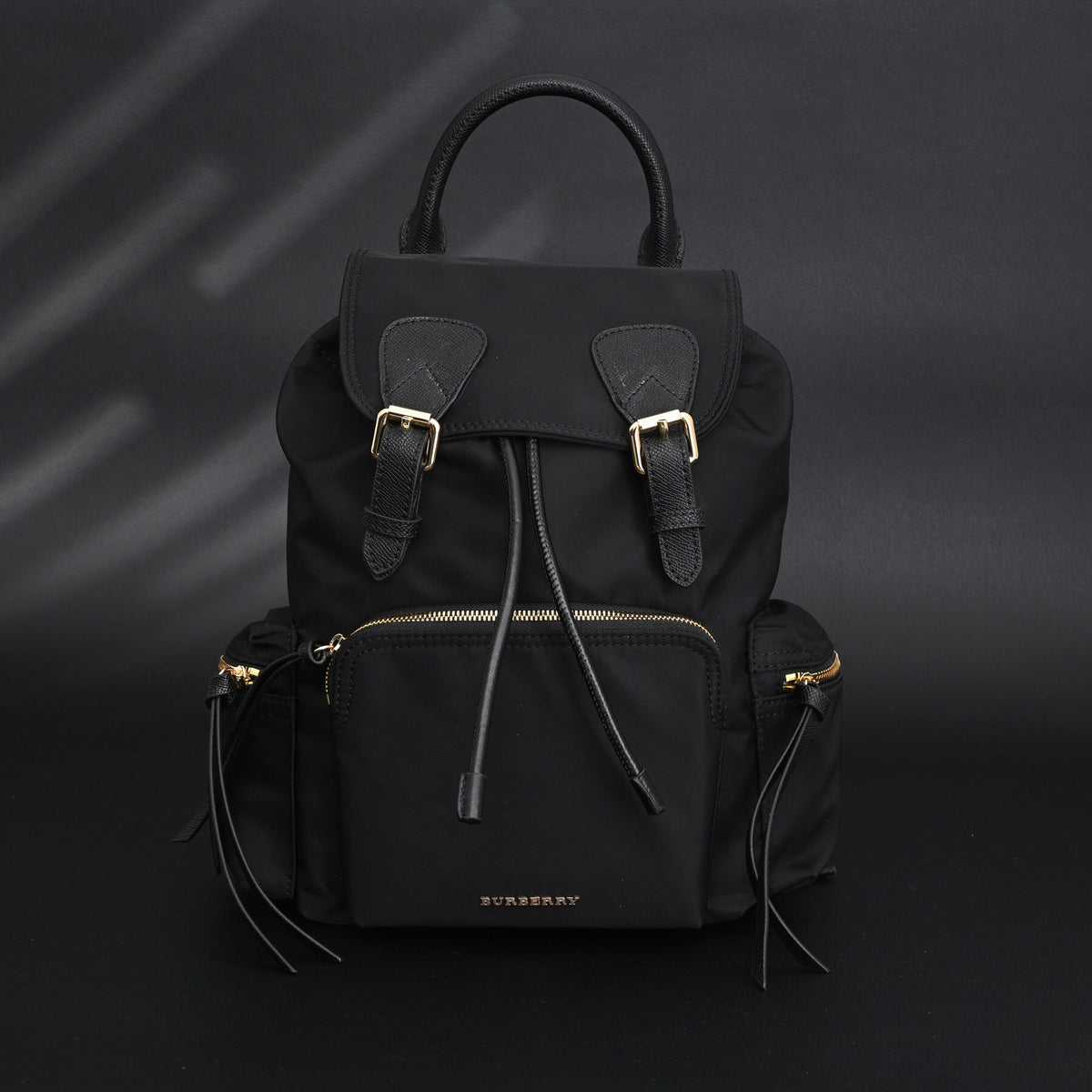 Burberry the Rucksack – Black Nylon & Leather Backpack with Gold-Tone Hardware - Black with Gold Accents product image 1,
