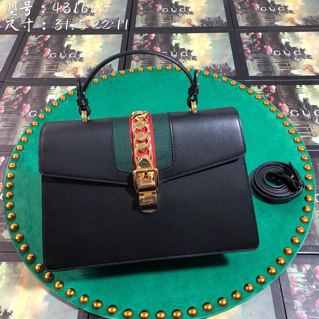 Gucci GG Sylvie Leather Medium Top Handle Bag - Black product image 1, provided for visual reference and product detail