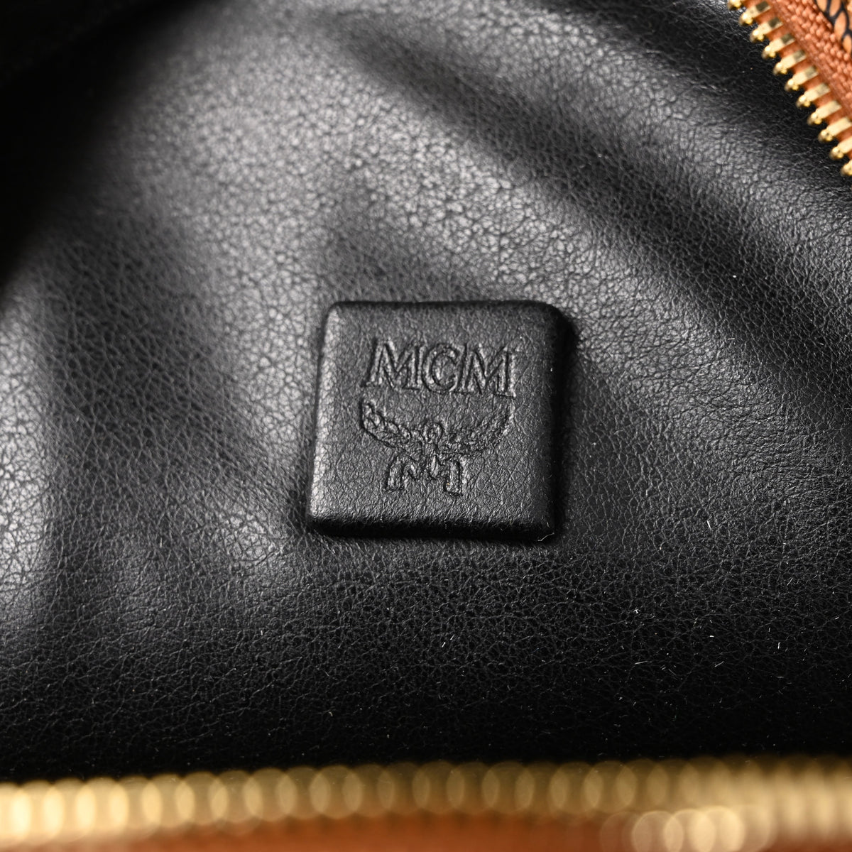 Mcm Stark Visetos Medium Backpack – Cognac Monogram with Gold-Tone Studs - Cognac with Black Monogram Print product image