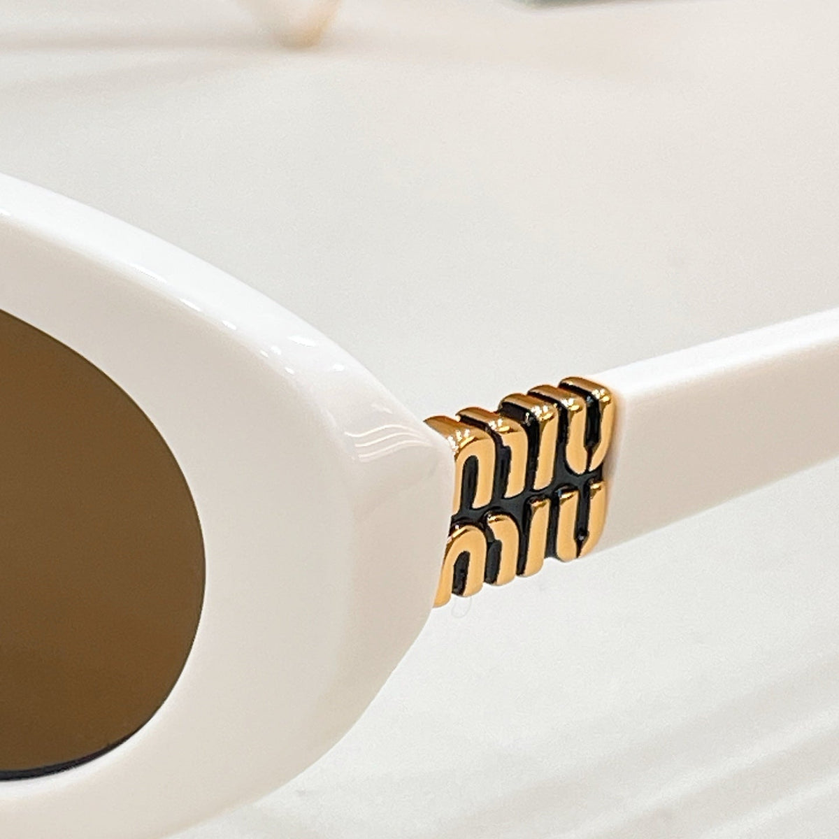 Miu Miu VMU 85S Sunglasses product image 7, provided for visual reference and product detail review